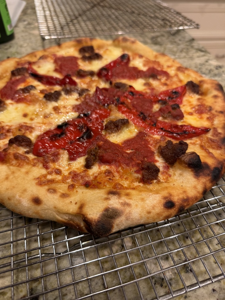 Jimmy Nardello pepper and nduja pizza cooling on a wire rack